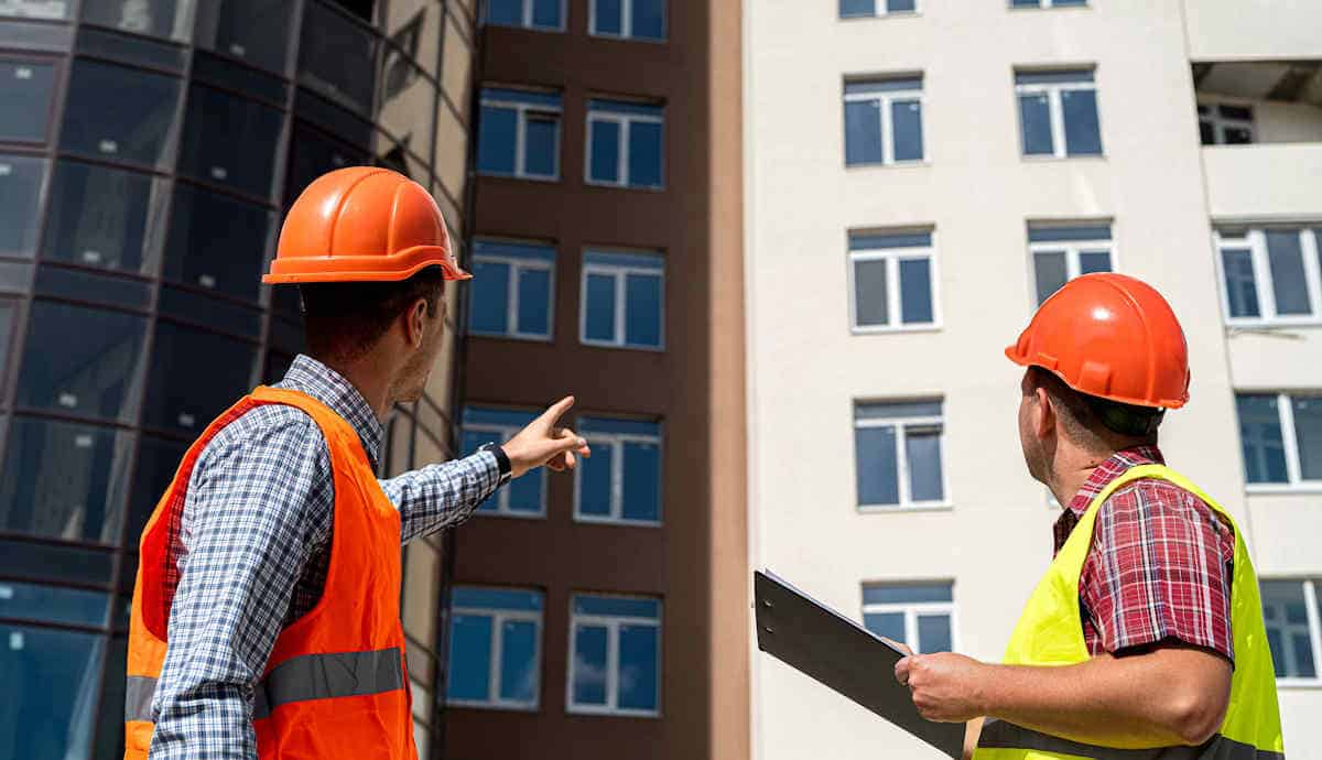 Surveyors inspecting cladding